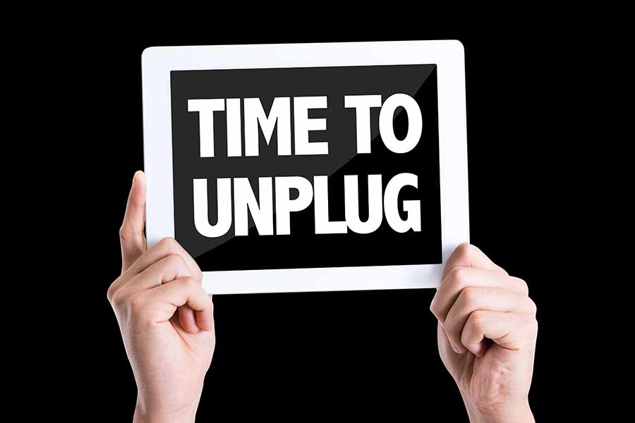 Tablet con mensaje: Time to unplug