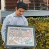 Alex Carrillo presents two of his works in the Spirit of the Season exhibit at the Walt Disney Family Museum