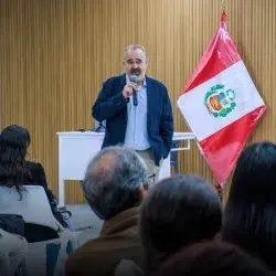 Professor speaking in front of an audience.