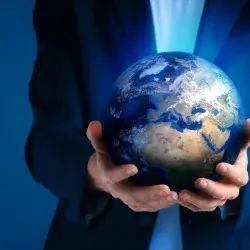 They analyze international security at a forum, with a person holding the globe in their hands